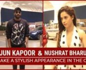 Arjun Kapoor and Nushrat Bharucha were spotted at Mumbai airport. Panipat star Arjun Kapoor looked dapper in a black sweatshirt as he clicked pictures with his fans. Nushrat, on the other hand, looked like a vision in white and black jumpsuit.
