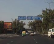 The following footage are a composite of short clips that were photographed on the trip from New Delhi International Airport to the Hotel Janpath in India. Shot with an Aptec HD 1080P flip cam on Sunday, November 30. Traffic is light with the appearance of chaotic behavior, yet orchestrated in a safe traveling experience. Traffic lights and signs exist and are obeyed. Three-wheeled tuktuk taxis, motorcycles, bicycles, horses, buses, trucks (Tata) and automobiles share the road with harmonious in