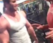 Arnold Schwarzenegger and myself at Golds gym, Venice. He is showing me a few variations to the mandatory poses judged in bodybuilding today.