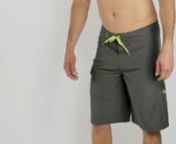 Model wearing Salt Life Stealth Bomberz Boardshorts to show the fit