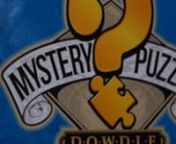 Introducing: Dowdle Mystery Puzzles (available in 500 &amp; 1,000 pieces)nnYou will only be able to unlock the secret of your mystery puzzle by putting it together. With more than 400 Dowdle titles to choose from, there’s no telling which tantalizing title you will get. One thing we can guarantee is that you’ll have a magical time seeing the image come alive.nnDowdle Mystery Puzzles come with a special sealed black envelope. Inside the envelope is a color print of the image. So, if you absol
