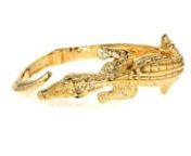 https://www.ross-simons.com/888367.htmlnnAdd a touch of whimsy to your wrist with our stylish alligator bypass bangle bracelet. Made in Italy of textured 18kt gold over sterling silver with exceptional attention to detail and craftsmanship. Sparkling emerald-accented eyes further enhance its appeal. 18kt yellow gold over sterling silver alligator bangle bracelet.