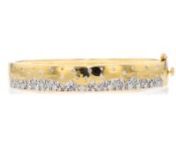 https://www.ross-simons.com/981588.htmlnnReminiscent of fresh champagne bubbles, this stackable bangle gives you a reason to celebrate! 1.00 ct. t.w. round and round brilliant-cut diamonds are scattered across a high-polished bracelet of 18kt yellow gold over sterling silver. Hinged with a figure 8 safety. Box clasp, scattered-diamond bangle bracelet.