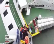 In video clips released Monday by the coast guard, the captain of the South Korean ferry that sank April 16th is rescued wearing only a sweater and dark blue underpants as he leaps from the sinking ferry onto a rescue boat.