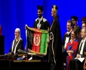 Credit: SWNS / Naimat Zafary&#60;br/&#62;&#60;br/&#62;A refugee who fled the Taliban in Afghanistan on a plane with just a backpack has graduated a UK university with a master’s degree.&#60;br/&#62;&#60;br/&#62;Naimat Zafary, 37, graduated from Sussex University with a merit in Governance, Development and Public Policy this week.&#60;br/&#62;&#60;br/&#62;He was forced to flee his home in Kabul, Afghanistan, when the Taliban took over in August 2021. &#60;br/&#62;&#60;br/&#62;Naimat was evacuated by British troops with his wife, Saima, 30, and four children in August 2021.&#60;br/&#62;&#60;br/&#62;The family took just a backpack each - containing food, water and a change of clothes.&#60;br/&#62;&#60;br/&#62;After spending four months in a hotel in London, the Home Office arranged a permanent move to Hove, East Sussex, in December 2021.&#60;br/&#62;&#60;br/&#62;