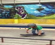 Boy on skateboard attempts 50-50 grind on rail at skatepark and lands on his arm from ha rail video