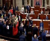 Representatives celebrate and wave flags after Congress passes Ukraine aid packageHouse TV via Reuters
